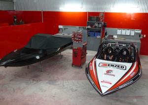 Caughey’s championship-winning boat (right) beside a client boat in the new workshop