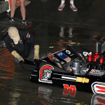 Crew chief Ross Baynes checking the reverse bucket as he tries to keep Peter Caughey in the event.